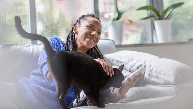 woman petting cat