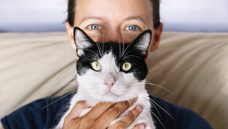 Man holding cat